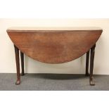 An early 19th century mahogany circular drop leaf dining table, D. 122cm.