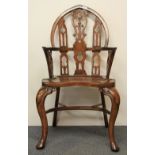 A superb Gothic style hardwood Windsor type armchair.