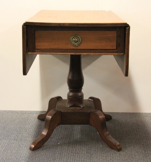 An early 19th century drop leaf mahogany tea table.