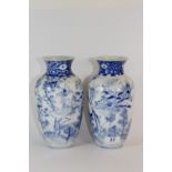 A pair of 19th century hand painted Japanese porcelain vases, H. 22 cm.