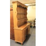 A large pine kitchen dresser, W. 136cm, H. 190cm.