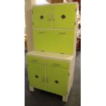 A 1950s painted kitchen cabinet with enamelled drop down work surface, W. 86cm, H. 177cm.