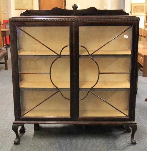A 1930s ball and claw foot mahogany display cabinet, W. 118cm x H. 137cm.