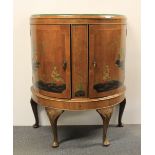 A 1930s chinoiserie decorated walnut veneered cabinet. W. 78 cm. H. 97 cm.