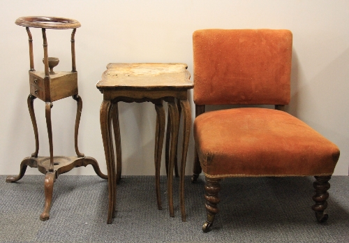 A nest of three walnut tables, an upholstered Victorian chair and a smokers stand.