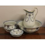 An Edwardian Losol Ware wash jug, bowl, chamber pot and soap dish