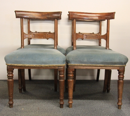 A set of four early 19th century mahogany dining chairs.