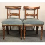 A set of four early 19th century mahogany dining chairs.