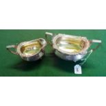 A George III silver twin handled sugar,