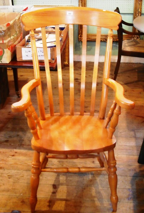 A modern beech Windsor armchair.