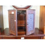 A late 19th century oak humidor cabinet,