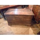 An early 19th century oak and elm coffer