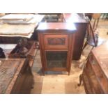 An Edwardian mahogany music cabinet, the