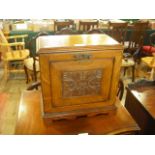 An Edwardian oak stationery cabinet, the