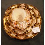 A Royal Crown Derby bone china trio, dec