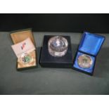 Three boxed paperweights, including a Pe