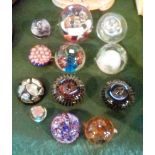 A collection of twelve glass paperweight