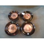 Four pot lids, each in an ebonised wood