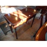 An Edwardian mahogany writing table 'The