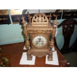 A 19th century gilt metal cased lantern-type mantle clock, the American eight day gong striking