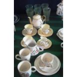 A Shelley part duet tea set, gilt decorated with fruit on a shaded yellow ground, a Poole milk jug