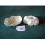 A pair of Belleek shell-moulded salts of oval form.
