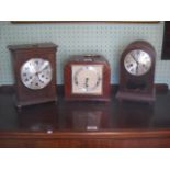 A 1930's walnut cased mantle clock by Elliott and two other mantle clocks.