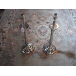 A pair of plated table lamps with cushion bases,