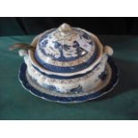 A Staffordshire blue and white transfer printed tureen and cover with associated stand an plated