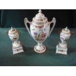 A garniture of three covered vases, gilt decorated and transfer printed with floral sprays.
