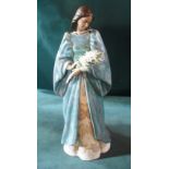 A Lladro Privilege figure, modelled after the Madonna as a young woman standing holding a spray of