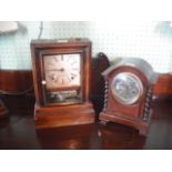 A late 19th century American mantle clock in a rosewood case and a mahogany cased mantle clock with