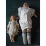 Two wax headed dolls.