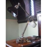 A contemporary chromium plated adjustable table lamp, base 17cm square.