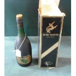 A cased bottle of Remy Martin Fine Champagne Cognac.