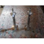 A pair of plated table lamps of reeded f