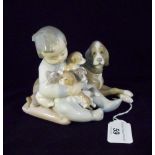 A Lladro 'New Playmate' figure group, number 5456, 11cm.
