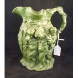 A Minton Bacchus relief decorated green water jug, marked no. 19, 23cm.