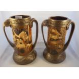 A pair of Bretby bronze effect Art Nouveau twin handled vases,