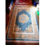 A contemporary Chinese rug, blue central panel and light blue outer border, 119 x 182cm.