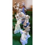 A collection of six Lladro figurines, to include: 'A Girl with a Scarecrow', numbered 5385,
