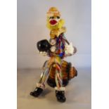 A 1960's Murano glass clown, seated on a barrel, 28cm.