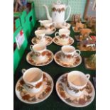 A Wedgwood Susie Cooper design coffee service, 'Brown Art Nouveau', comprising: coffee pot,