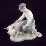 A Royal Copenhagen Herdsman and Pig Figu