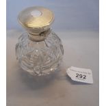 A cut glass silver scent bottle with gla