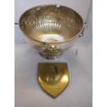 A large silver plated punch bowl with tw