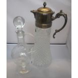 A clear glass wine decanter of bulbous f