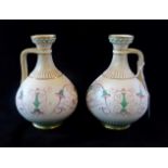 A pair of late 19th century Minton vases with single handles, decorated in the Art Nouveau manner,