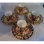 A set of four early 20th century Royal Crown Derby trios, comprising: coffee cup,