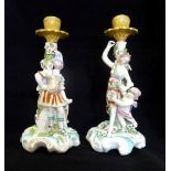 A near matching pair of Derby figural candlesticks, modelled as Venus & Cupid and Mars, circa 1765,